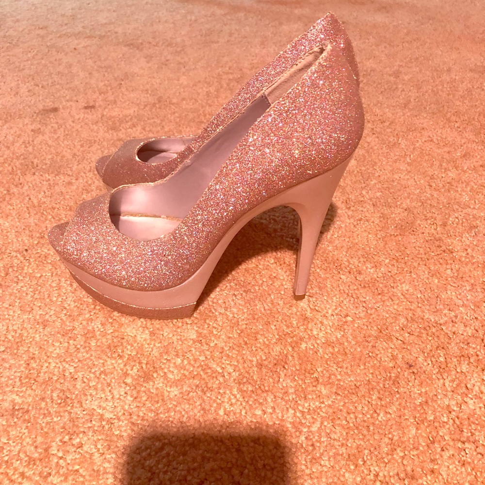 Multicolored glitter open toe heels.